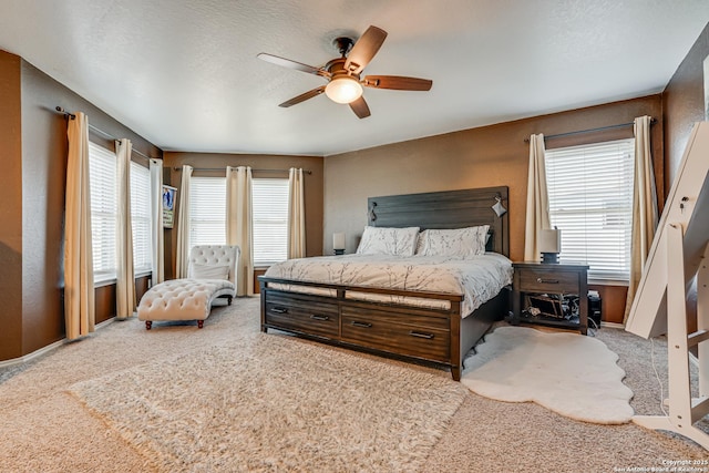 bedroom with ceiling fan and carpet