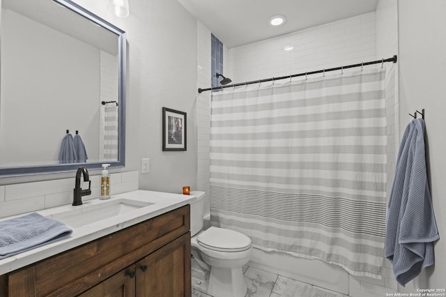 full bathroom featuring vanity, toilet, and shower / bath combo with shower curtain