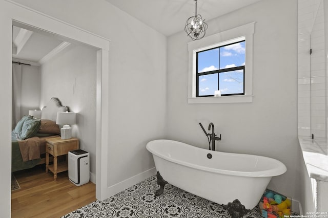 bathroom featuring wood-type flooring, a bath, and a notable chandelier