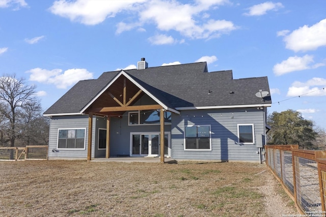 rear view of property featuring a patio area