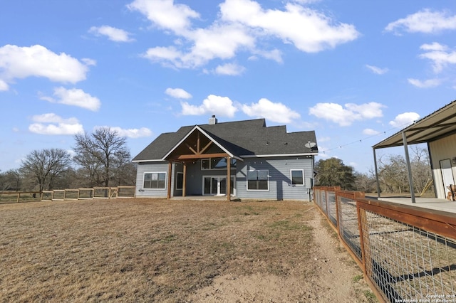 back of house with a patio