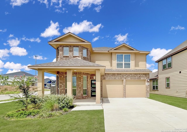 view of front of home featuring a garage and a front lawn