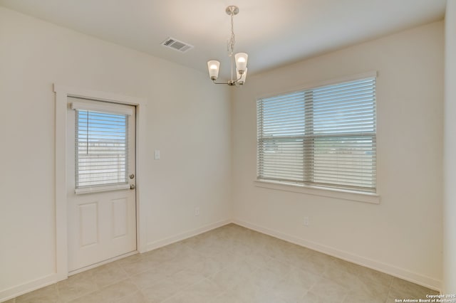 empty room with a chandelier