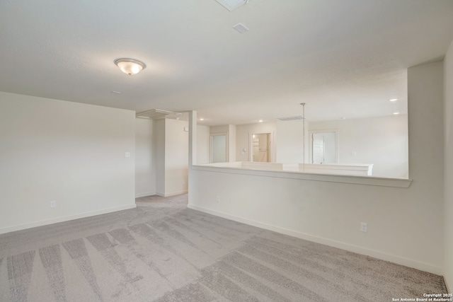 unfurnished room with light colored carpet