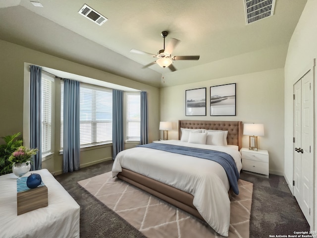 bedroom featuring dark carpet and ceiling fan