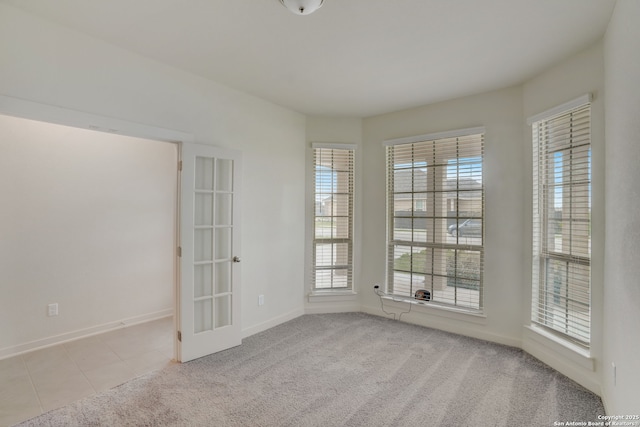 unfurnished room with light colored carpet