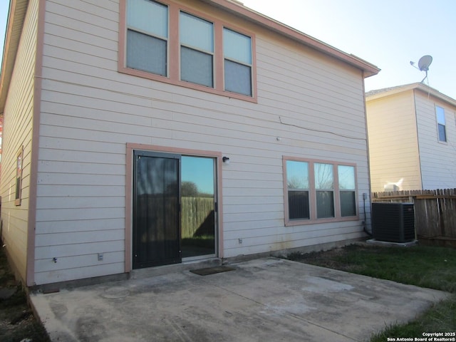 back of house with central AC unit and a patio area