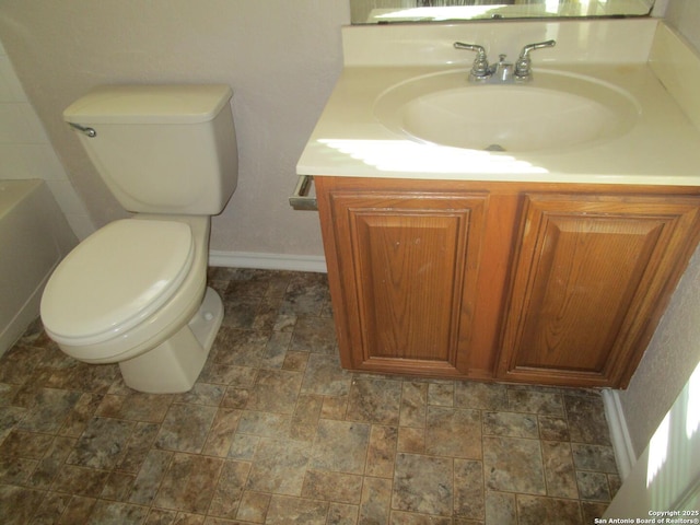 bathroom with vanity and toilet