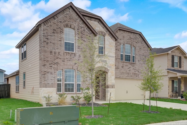 view of front of property with a garage and a front yard