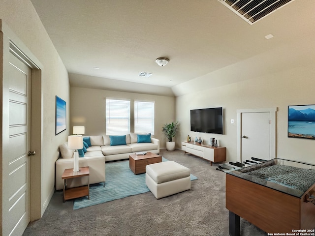 living room with vaulted ceiling and carpet flooring