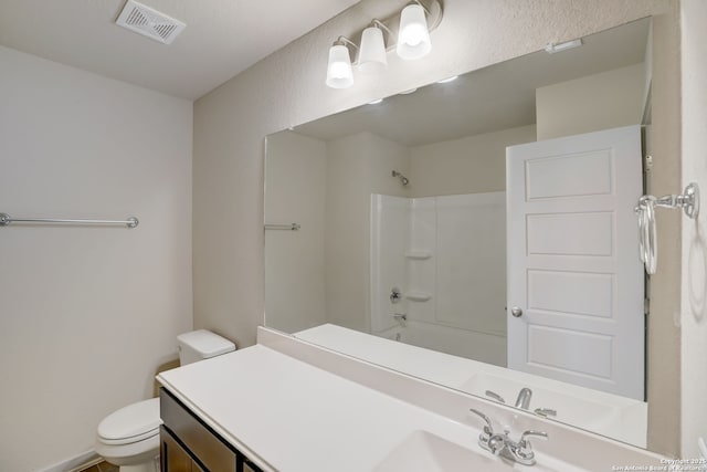 full bathroom with vanity, shower / bathing tub combination, and toilet