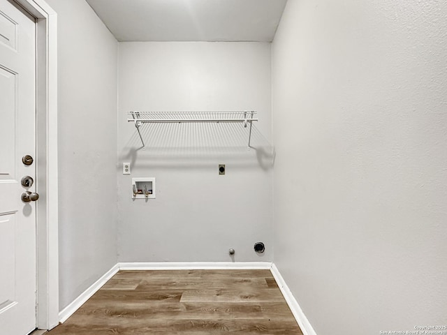 laundry room featuring laundry area, washer hookup, wood finished floors, baseboards, and electric dryer hookup