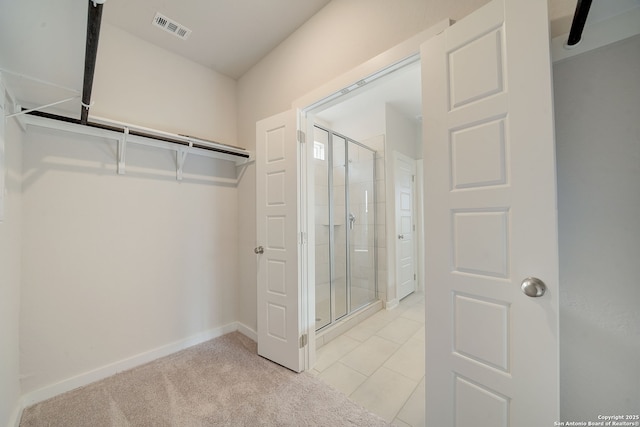 spacious closet with light tile patterned flooring