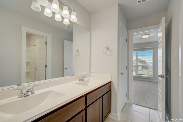 bathroom with tile patterned flooring and vanity