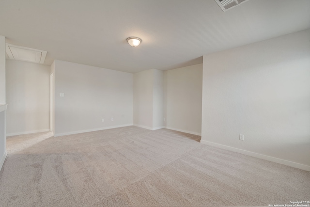 empty room featuring light colored carpet