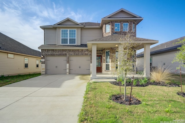 view of front of home with a garage and a front lawn