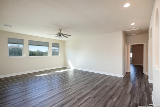 unfurnished room featuring ceiling fan and dark hardwood / wood-style flooring