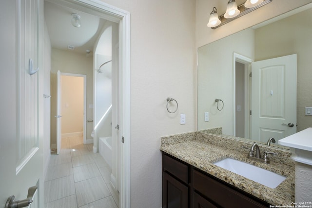 bathroom featuring shower / tub combination, vanity, and tile patterned floors