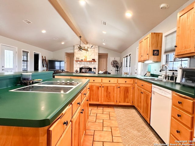 kitchen with sink, vaulted ceiling with beams, ceiling fan, white dishwasher, and black electric cooktop