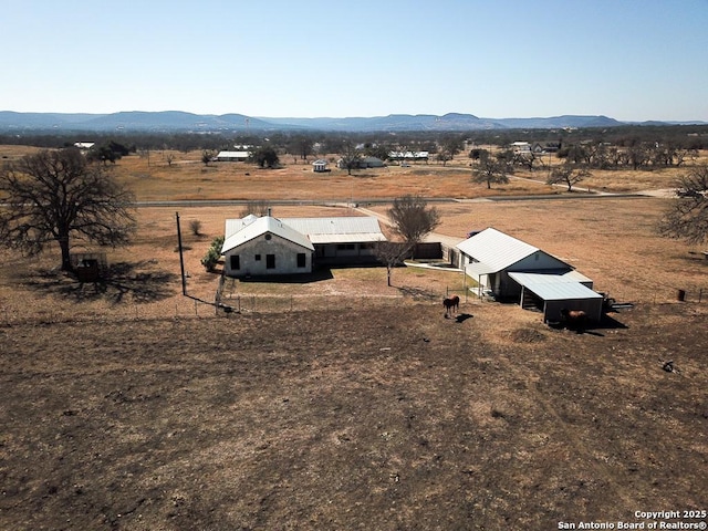 drone / aerial view featuring a rural view and a mountain view