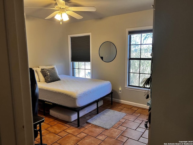 tiled bedroom with ceiling fan