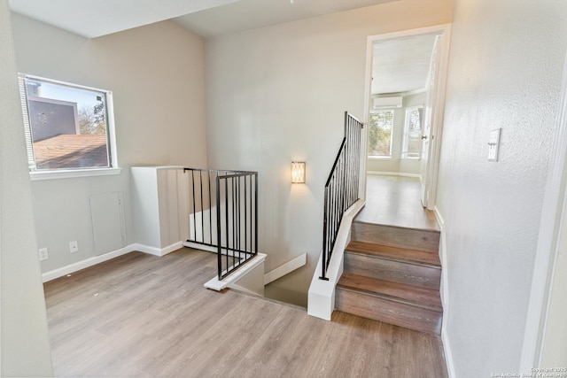 staircase featuring hardwood / wood-style floors