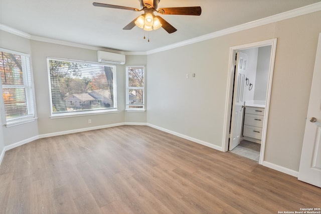 empty room featuring light hardwood / wood-style floors, ornamental molding, an AC wall unit, and ceiling fan