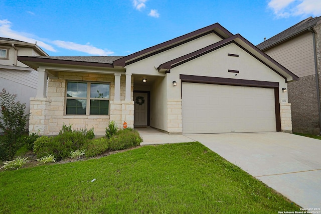 single story home featuring a garage and a front yard