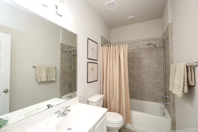 full bathroom featuring vanity, shower / tub combo, and toilet