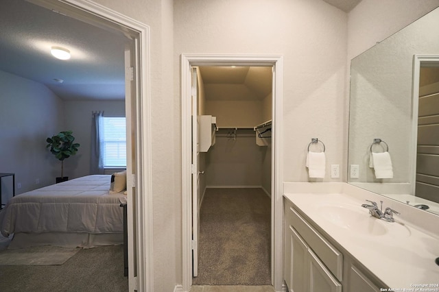 bathroom with vanity and a textured ceiling