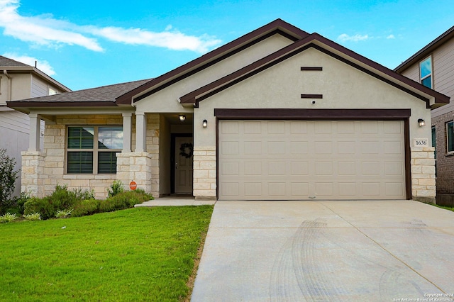 view of front of house with a garage and a front lawn