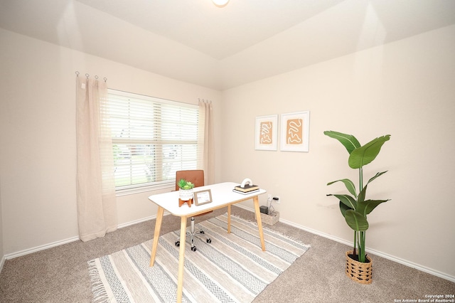 office area featuring carpet floors and vaulted ceiling