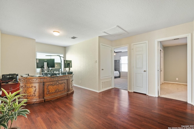 office area featuring dark hardwood / wood-style floors and a textured ceiling