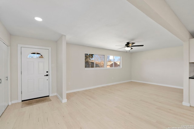 entrance foyer with ceiling fan and light wood-type flooring