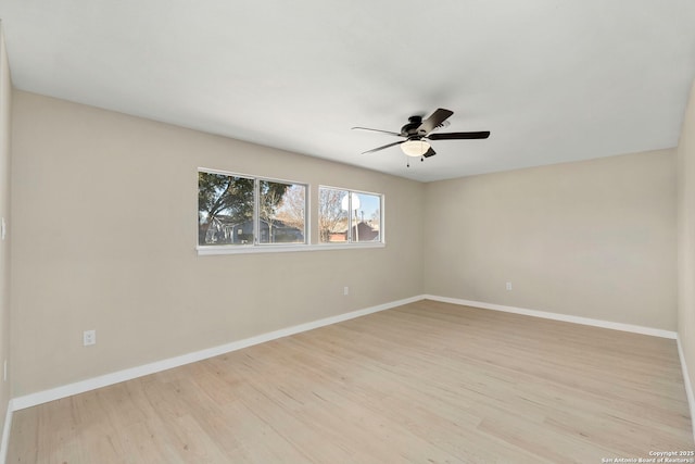 empty room with ceiling fan and light wood-type flooring