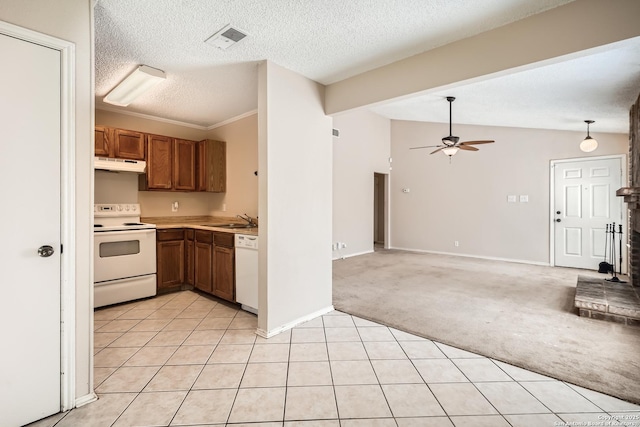 kitchen featuring light carpet, white appliances, visible vents, under cabinet range hood, and a sink