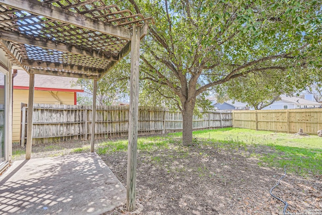 view of yard with a fenced backyard, a pergola, and a patio