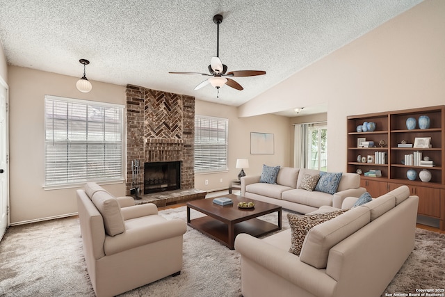 living area with light carpet, a fireplace, vaulted ceiling, and a textured ceiling