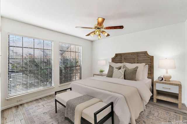 bedroom featuring wood-type flooring and ceiling fan