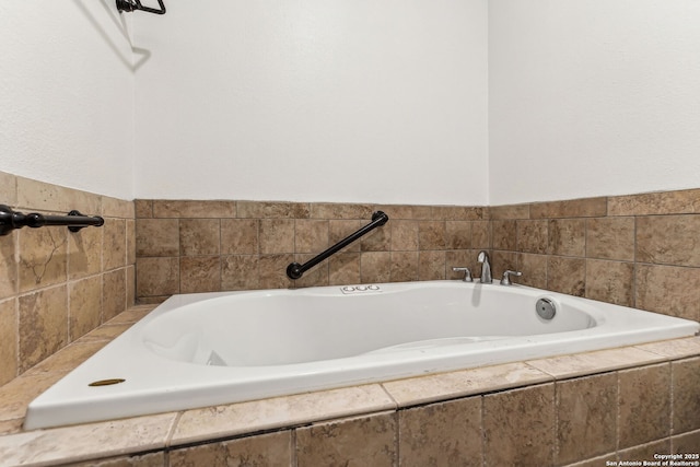 bathroom featuring tiled tub