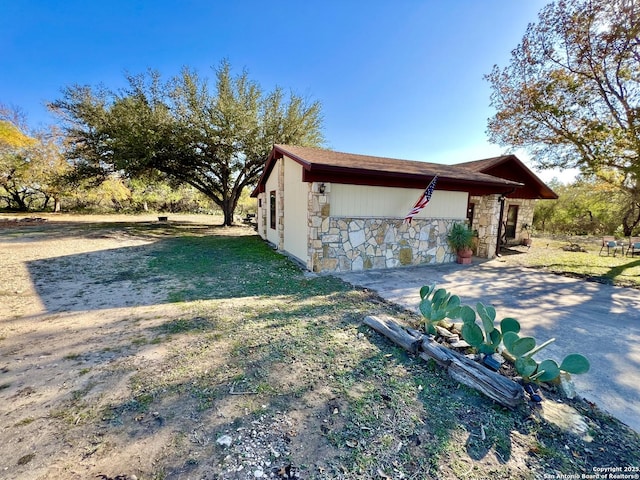 view of home's exterior with a yard