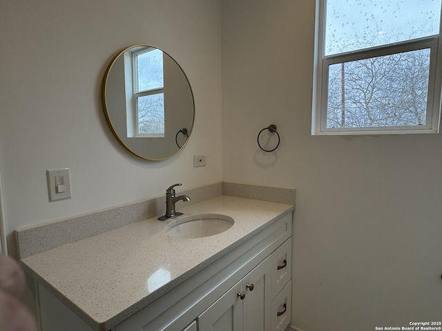 bathroom with vanity and a healthy amount of sunlight