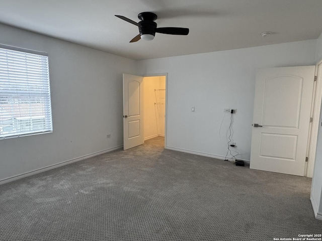 unfurnished bedroom featuring ceiling fan and carpet floors