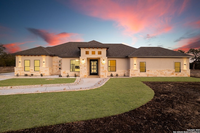 prairie-style house with a lawn