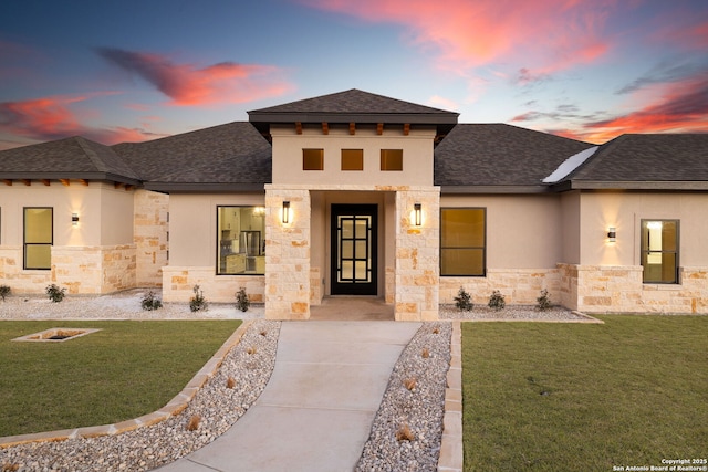 prairie-style house with a yard