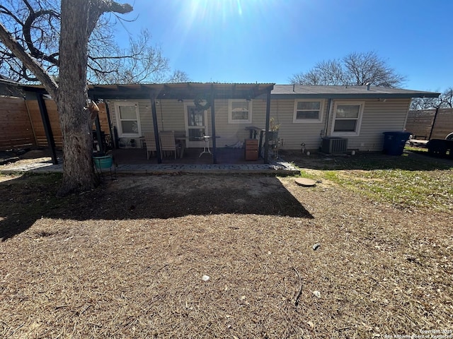 back of house featuring central air condition unit and a patio area