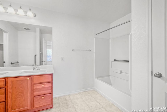 bathroom featuring vanity and shower / bathtub combination