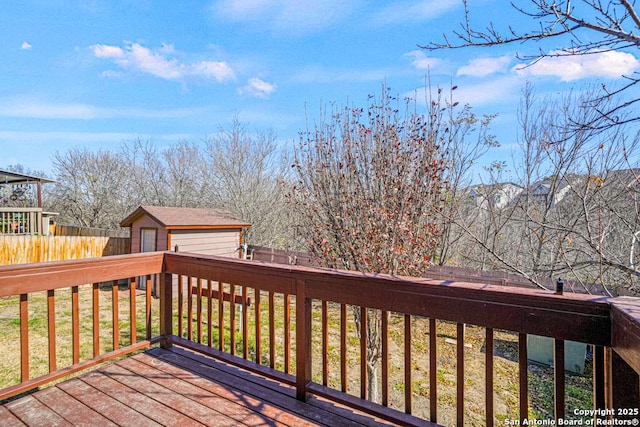 wooden deck featuring a shed