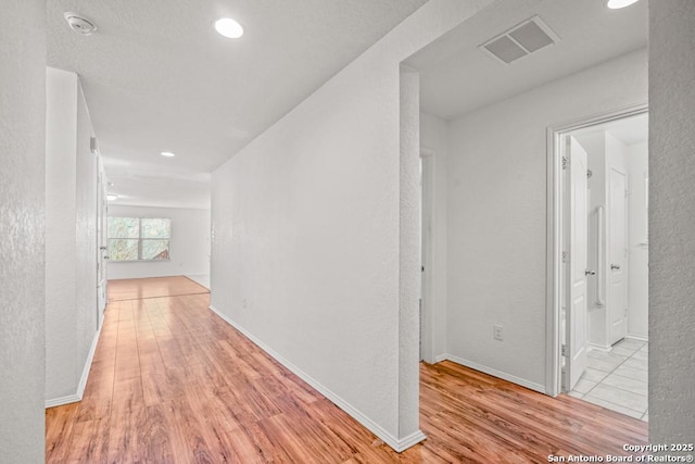 hallway featuring light hardwood / wood-style floors