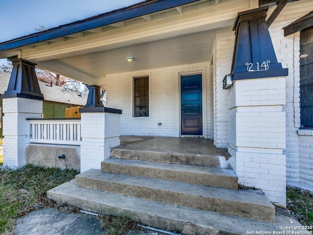 property entrance with covered porch